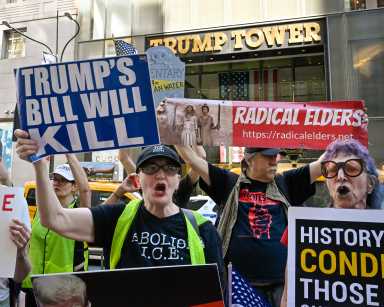 Demonstrators protest President Trump's 'Big Beautiful Bill' across from Trump Tower on 5th Avenue in New York, New York, on July 4, 2025.