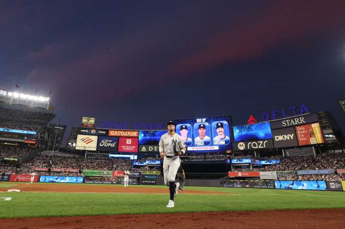 Aaron Judge injury latest: Yankees star participating in some baseball activities 3 Aaron Judge injury Yankees: Baseball player in white uniform runs toward dugout