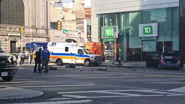 police officers and ambulance at scene of hit-and-run crash in Chinatown with debris on ground