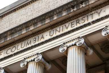 New York City, New York, USA - December 31, 2014: Columbia University inscribed on the Low Memorial Library facade at New York City's Columbia University