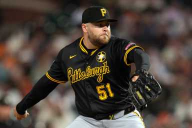 David Bednar Yankees Pirates: Man in black uniform delivers pitch during baseball game