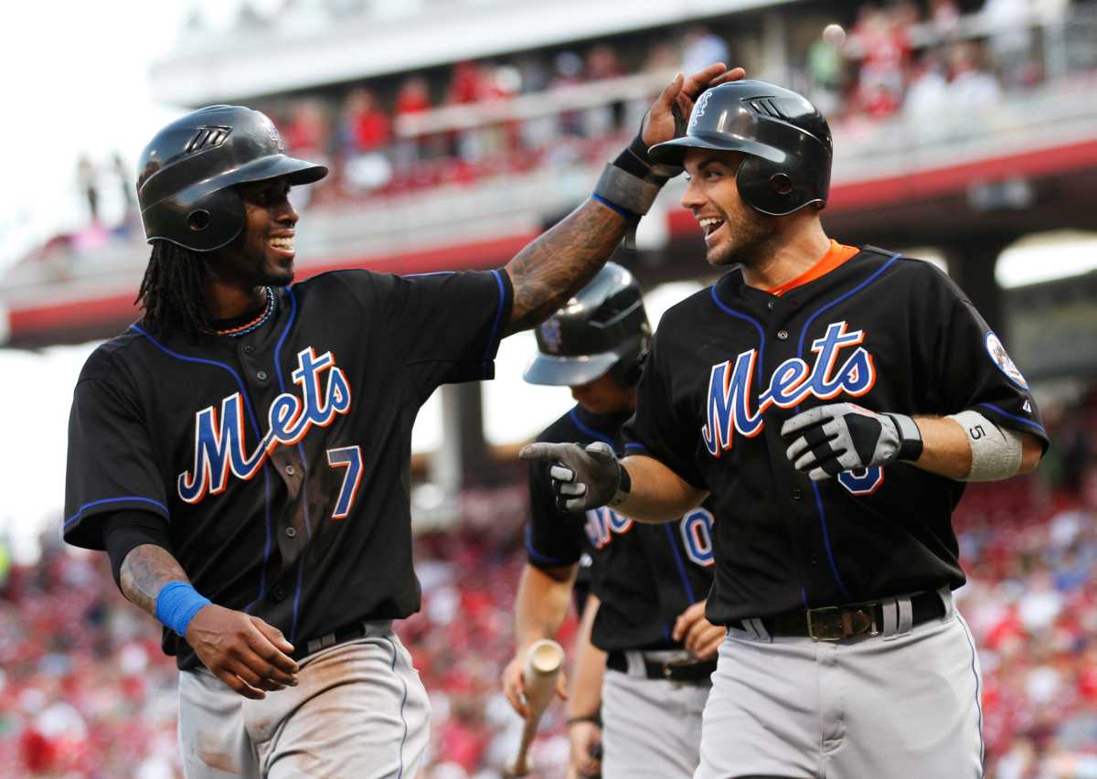 Jose Reyes David Wright: Baseball player #7 in black uniform congratulates baseball player #5 in black uniform