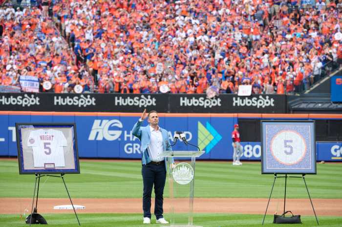 Emotional David Wright joins Mets elite with No. 5 jersey retirement 5 David Wright: Man in blue suit stands on baseball field and gives speech to fans.