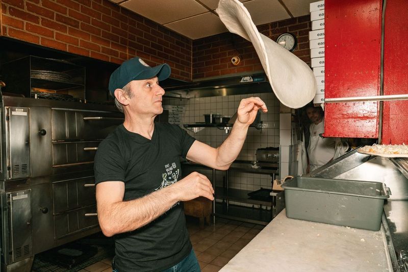 Frank Kabatas making pizza at East Village Pizza.