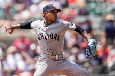 Yankees Marcus Stroman: Man in grey uniform throws baseball