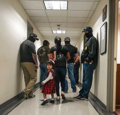 ICE agents in federal plaza apprehending immigrants