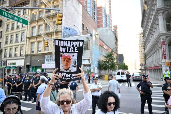 People protest ICE at 26 Federal Plaza.