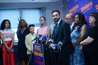 NYC Mayor's Race: Mamdani says Cuomo sees rent-stabilized tenants as 'political pawns' with means-testing proposal 26 man at podium with suit and beard zohran mamdani speaking about andrew cuomo