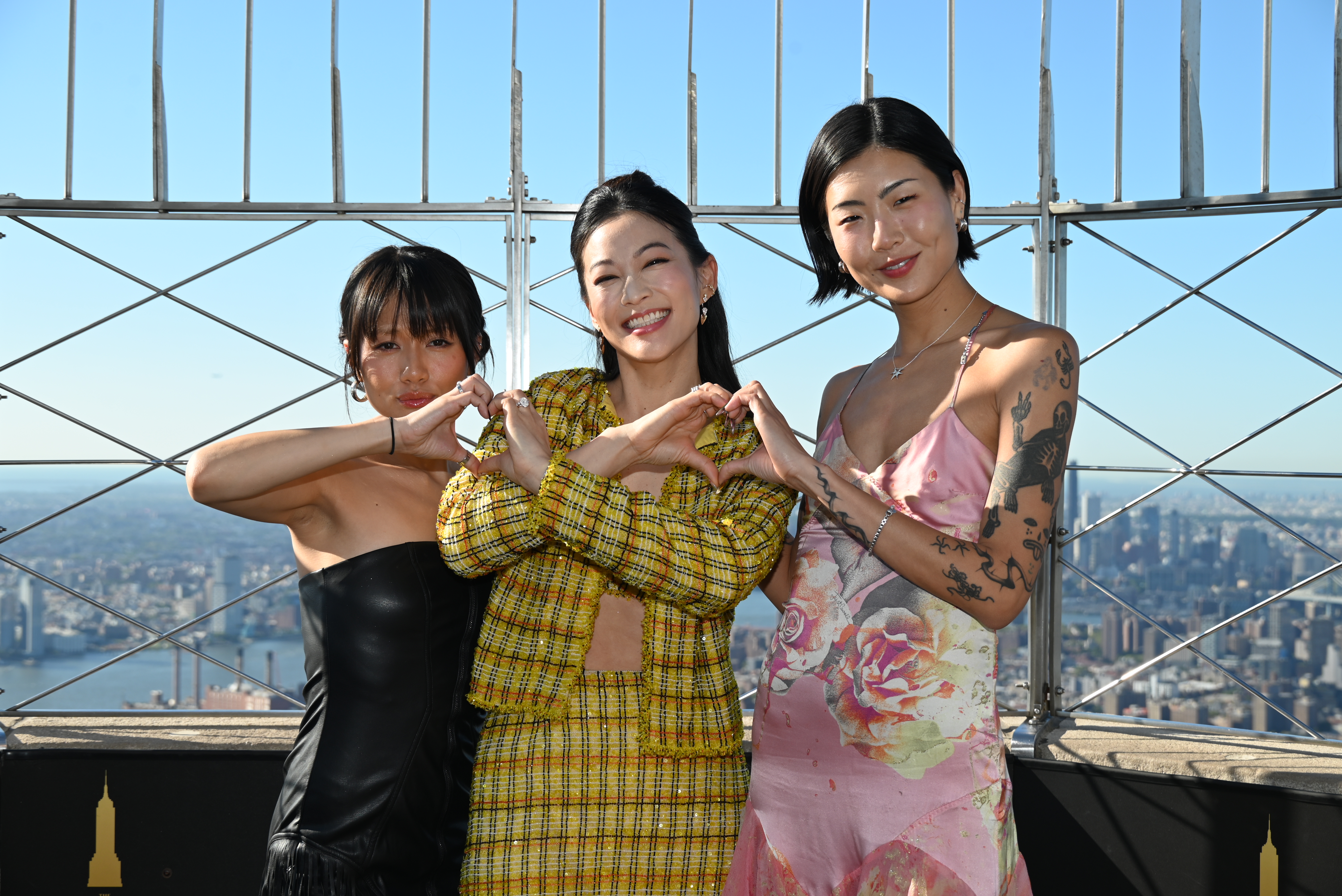 Arden Cho, May Hong and REI AMI of "K-Pop Demon Hunters" at the Empire State Building.