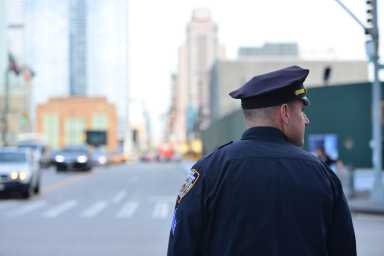 Editorial | NYC can effectively fight crime without troops 23 New York City, USA - October 8, 2017: A member of the New York City Police. The officer is patrolling the streets of manhattan