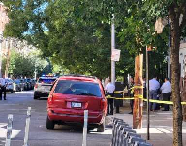 Bronx shooting rampage leaves man dead, two others wounded and suspect in custody 2 Police walk through area near shooting rampage scene in the Bronx