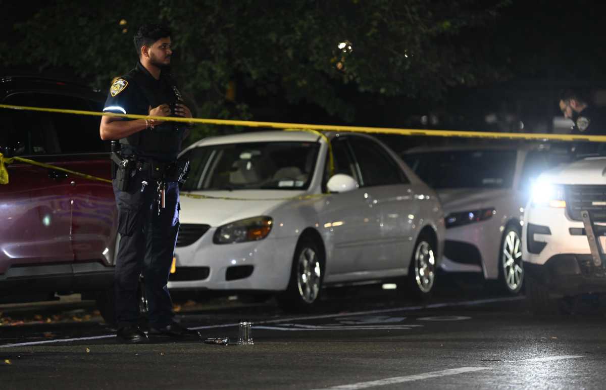 Latest shooting in the Bronx leaves three men wounded, suspects at large 1 cop at shooting scene with police tape stretched across street