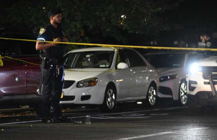 Latest shooting in the Bronx leaves three men wounded, suspects at large 3 cop at shooting scene with police tape stretched across street