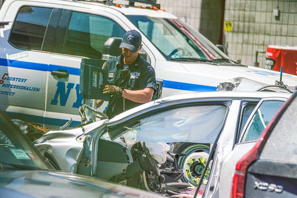 Carnage in Queens: Senior driver killed with two other men in crash near food cart had stroke weeks before wreck 1 Police officers examine scene of a deadly Queens crash