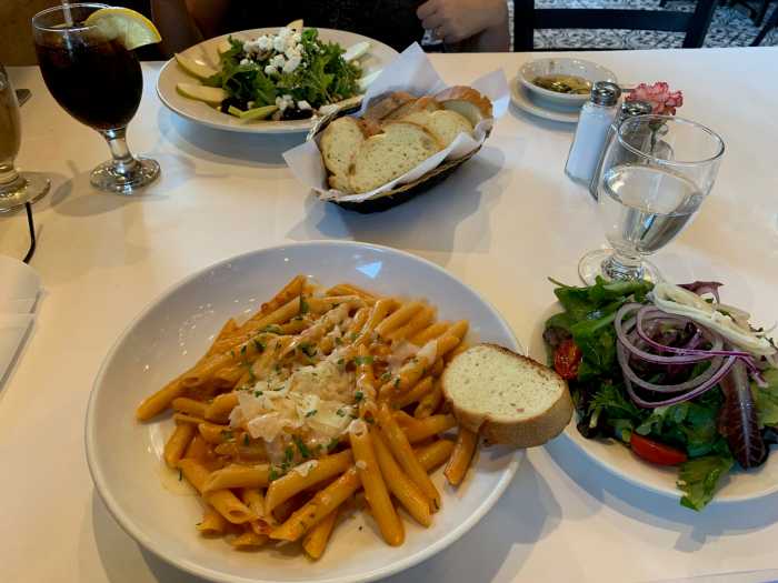 IBX Stop by Stop: Maspeth has small-town charm in America’s most crowded city 5 several plates of food on a table with a white tablecloth