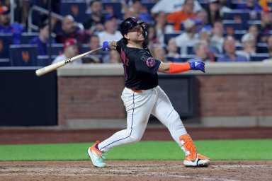 Mets' Francisco Alvarez feeling minimal pain in injured thumb, starting rehab assignment Wednesday 28 Francisco Alvarez injury Mets Mariners: Man in black uniform swings baseball bat