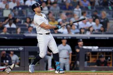 There's always the Twins: Yankees down Minnesota for rare W 15 Giancarlo Stanton Yankees home run: Man in white uniform watches ball after making contact