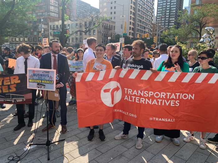 Victory on 34th Street: Transit groups, Manhattan pols leave bus in the dust in bustling Midtown 3 man in a dark suit surrounded by people holding signs