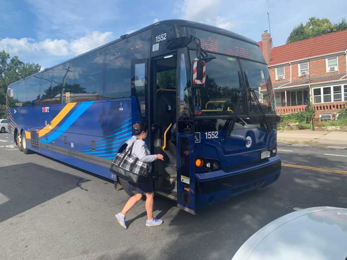On the Express: Queens express buses offer a smooth ride to Manhattan, for the most part 5 woman boards one of several Queens express buses on a sunny day